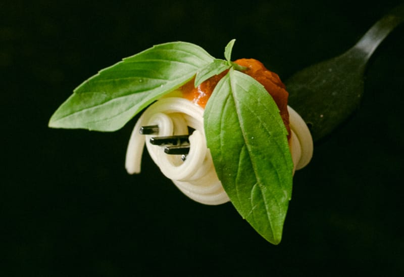 Decorate Picture of basil, tomato sauce and pasta on fork