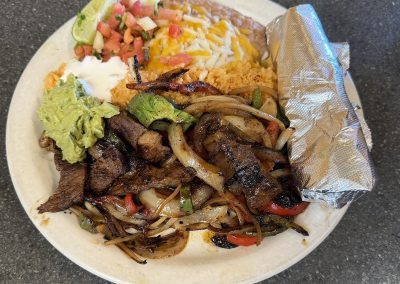 fajita plate with stake and flour tortillas