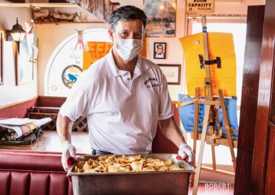 Gilberts El-Indio Robert Sturman Guy Holding Tortilla Chips