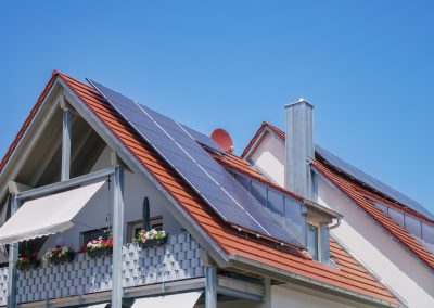 Home with solar energy green plants and sunny blue sky California Solar Home Solar